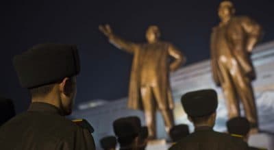 North Korean soldiers gather to pay their respects at the base of statues of the late leaders Kim Il Sung and Kim Jong Il at Mansu Hill in Pyongyang, North Korea, Monday, Dec. 16, 2013, the eve of the second anniversary of the death of Kim Jong Il. (David Guttenfelder/AP)