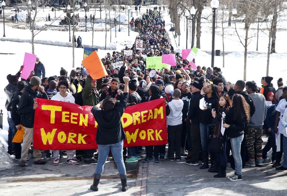 Young people from across Massachusetts marched through the Boston Common to the State House Thursday to press for more funding for youth summer jobs programs.  (Elise Amendola/AP)
