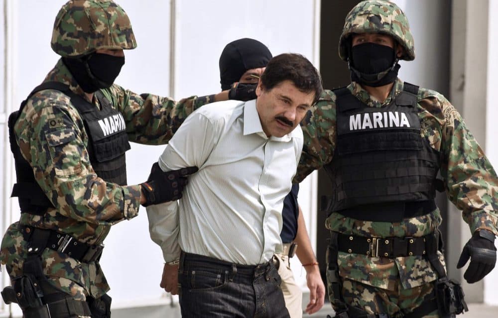 Mexican drug trafficker Joaquin Guzman Loera aka &quot;el Chapo&quot; Guzman&quot; is escorted by marines as he is presented to the press on February 22, 2014 in Mexico City. (Ronaldo Schemidt/AFP/Getty Images)