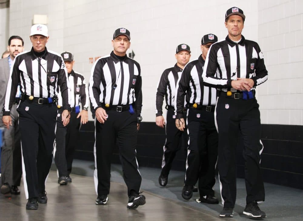 How many referees does it take to hear everything said on the field? (Doug Pensinger/Getty Images)