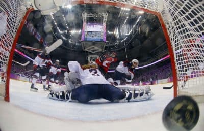 Marie-Philip Poulin of Canada (29) scores past USA goalkeeper Jessie Vetter (31) during the women's gold medal ice hockey game, Thursday, Feb. 20, 2014, in Sochi, Russia. (Mark Blinch/AP)