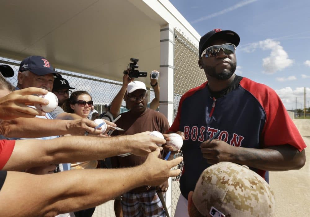 Boston Red Sox designated hitter David Ortiz signs autographs during spring training baseball practice, Sunday, Feb. 23, 2014, in Fort Myers, Fla. (AP)