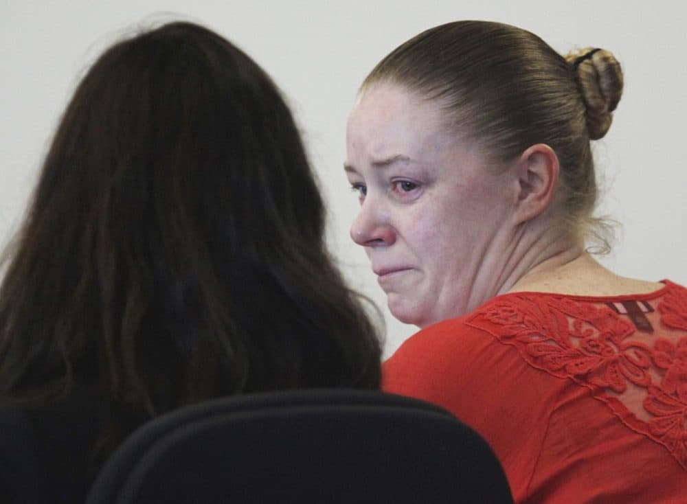 Aisling Brady McCarthy, right, from Quincy, Mass., sits with her attorney during a hearing in Middlesex Superior Court on Sept. 3, 2013. (Wendy Maeda/The Boston Globe/AP/Pool) 