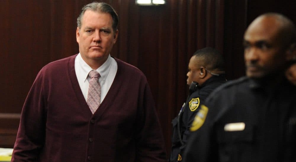 Michael Dunn returns to the courtroom during jury deliberations in his trial in Jacksonville, Fla., Thursday Feb. 13, 2014. Dunn was convicted of attempted murder in the shooting death of a teenager during an argument over loud music, but jurors could not agree on the most serious charge of first-degree murder. (Bob Mack/AP)