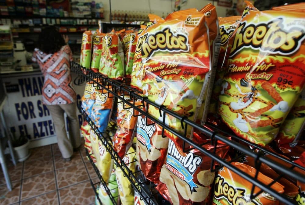 A typical corner store often has junk food near the front door and checkout counter. (AP/Reed Saxon)