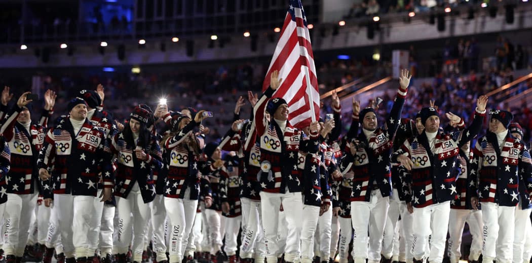 Todd Lodwick of the United States carries the national flag as he leads his team into the stadium during the opening ceremony of the 2014 Winter Olympics in Sochi, Russia, Friday, Feb. 7, 2014. (AP Photo/Patrick Semansky)