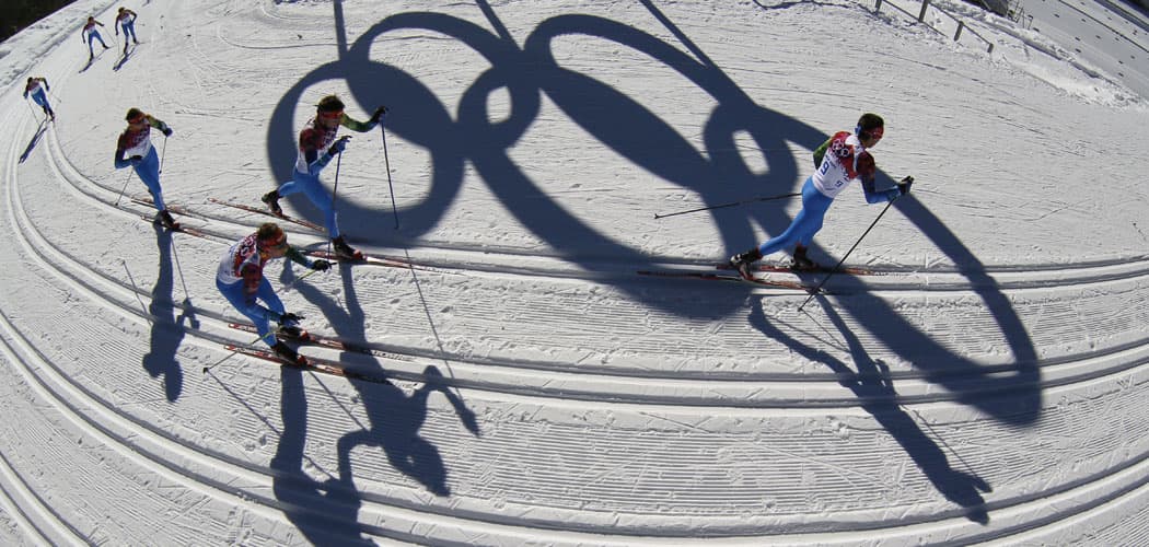 Athlete pass by the Olympic rings as they train on the cross-country track prior to the 2014 Sochi winter games, Thursday, Feb. 6, 2014, in Krasnaya Polyana, Russia. (AP Photo/Dmitry Lovetsky)