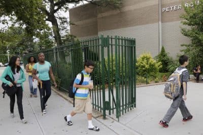 Students enter MS88, a New York City public middle school in the Brooklyn borough of New York on Wednesday, Aug. 7, 2013. A new AMA study suggests stress habits formed as young adults will follow teens throughout their lives. (AP)