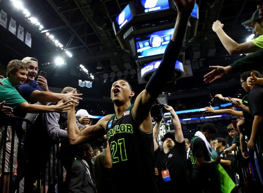 During March Madness, student-athletes like Baylor's Isaiah Austin become television stars. (Tom Pennington/Getty Images)