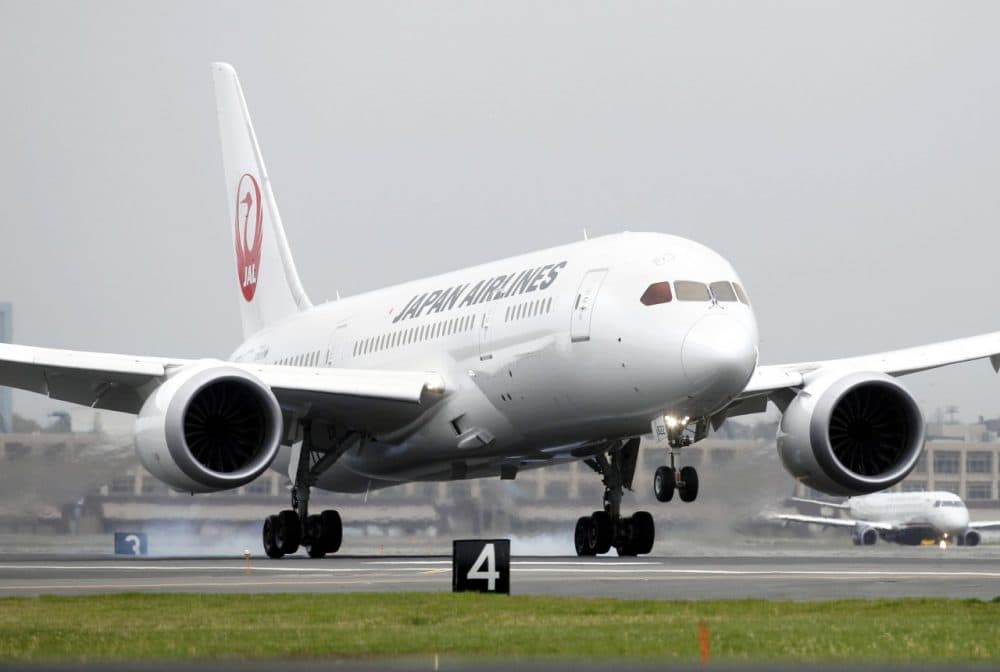 A Japan Airlines Boeing 787 lands at Logan International Airport in Boston on its inaugural, non-stop flight from Tokyo. (Michael Dwyer/AP)