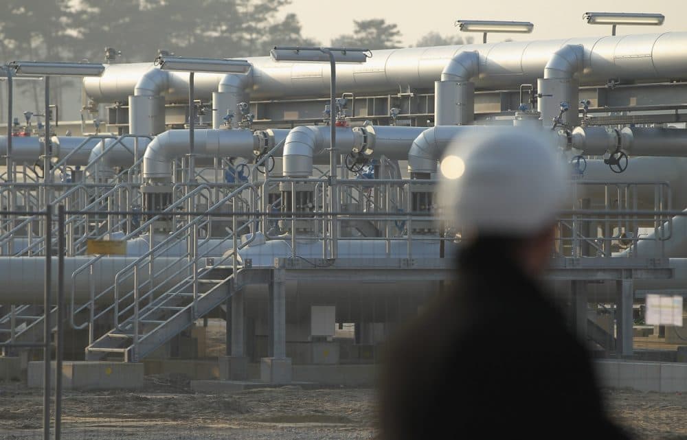A man wearing a hard hat looks out at the central facility where the Nord Stream Baltic Sea gas pipeline reaches western Europe following the pipeline's official inauguration on November 8, 2011 in Lubmin, Germany. (Sean Gallup/Getty Images)