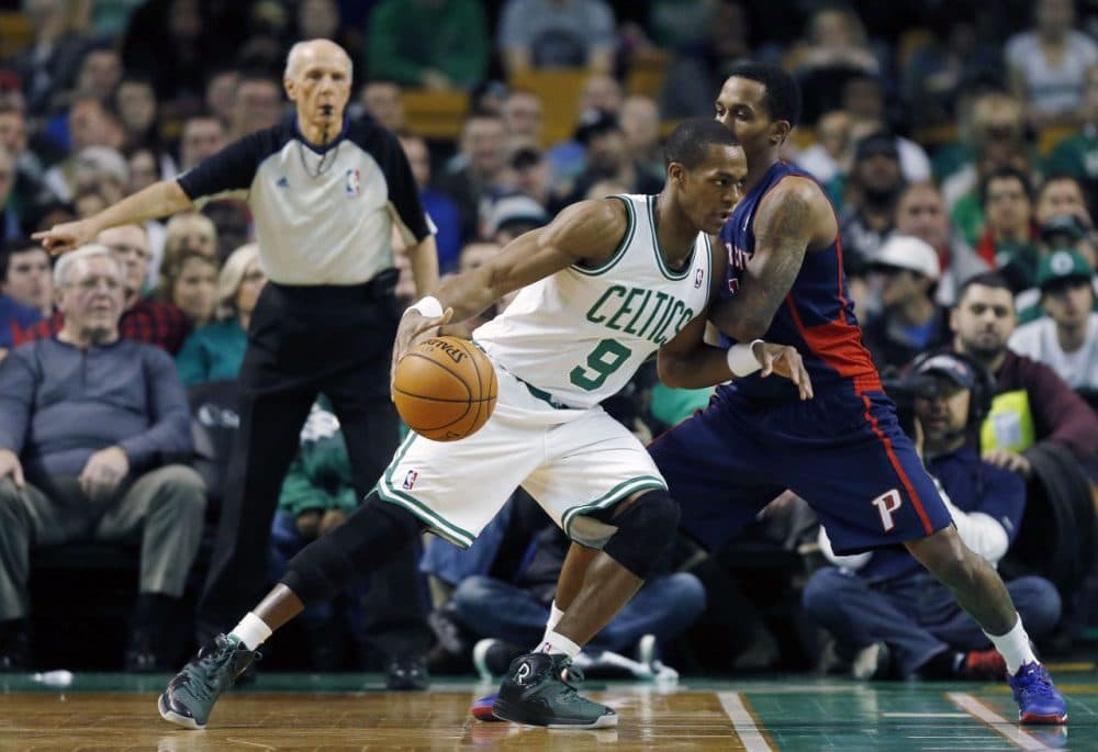 Boston Celtics' Rajon Rondo (9) drives past Detroit Pistons' Brandon Jennings (7) in the first quarter.  (AP/Michael Dwyer)