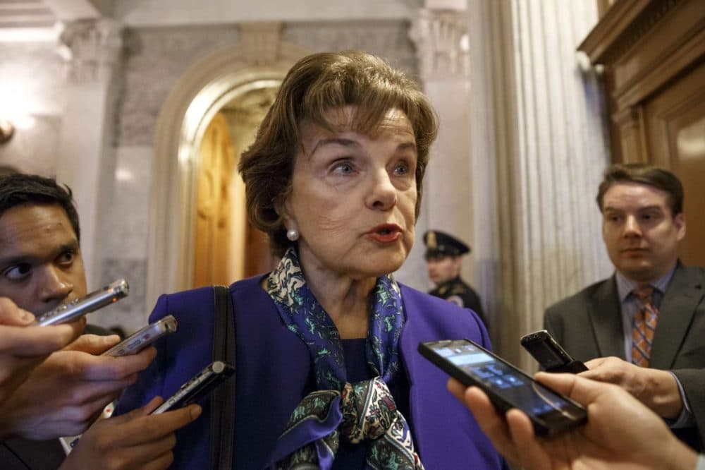 Senate Intelligence Committee Chair Sen. Dianne Feinstein, D-Calif. talks to reporters as she leaves the Senate chamber on Capitol Hill after saying that the CIA's improper search of a stand-alone computer network established for Congress has been referred to the Justice Department. (J. Scott Applewhite/AP)