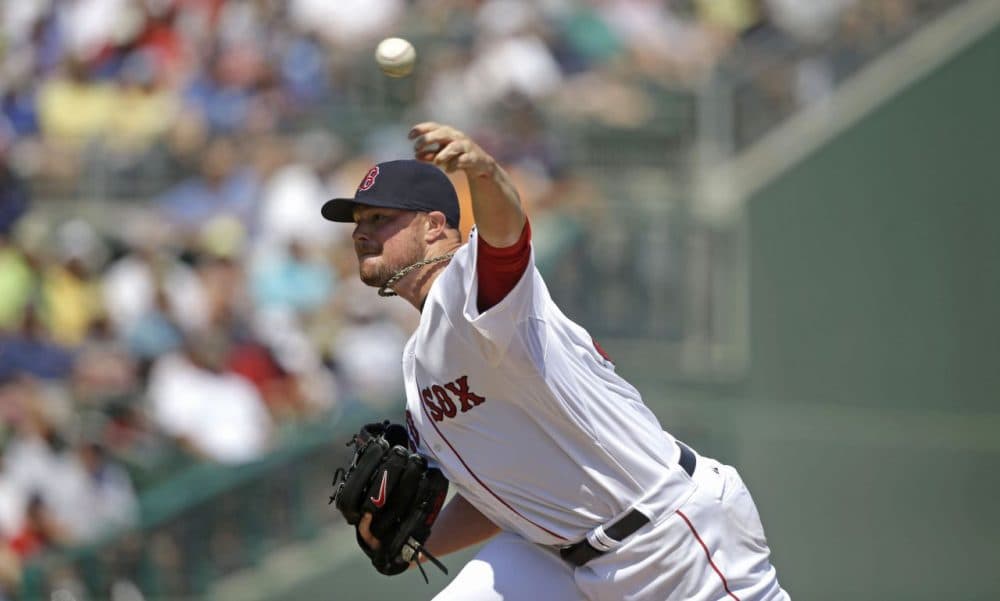 Boston Red Sox starting pitcher Jon Lester pitches in the first inning. (AP/Gerald Herbert)