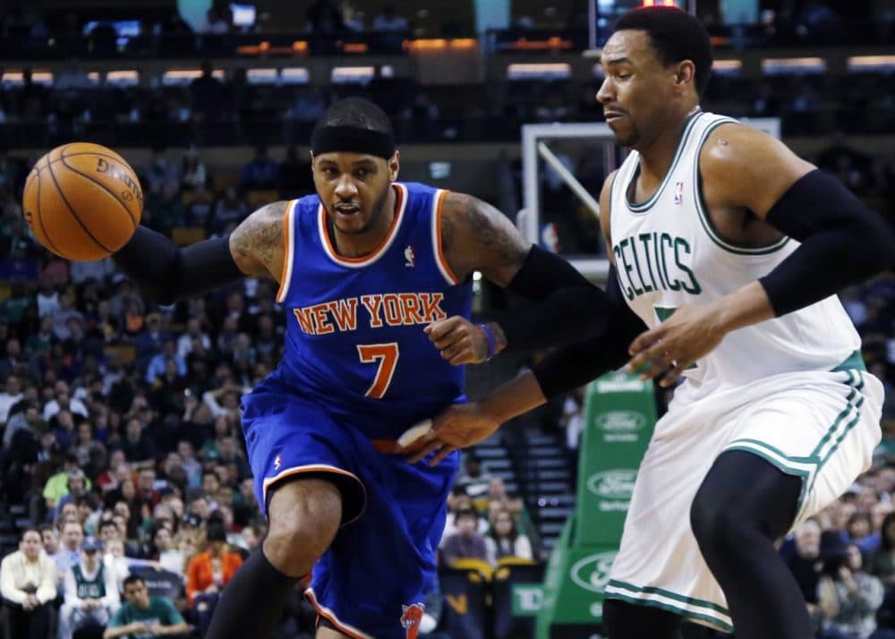 New York Knicks forward Carmelo Anthony, left, drives against Boston Celtics center Jared Sullinger. (AP/Elise Amendola)