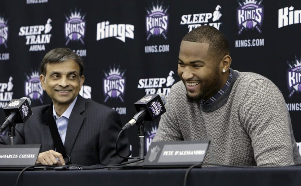 Vivek Ranadive (left) said the first call he made after purchasing the Sacramento Kings was to center DeMarcus Cousins (right). (Rich Pedroncelli/AP)