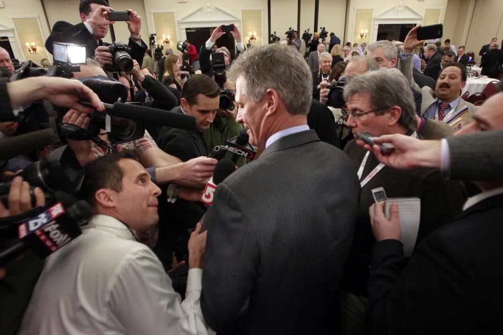 Scott Brown talks to media at the Republican Leadership Conference in New Hampshire in March.   (Jim Cole/AP)