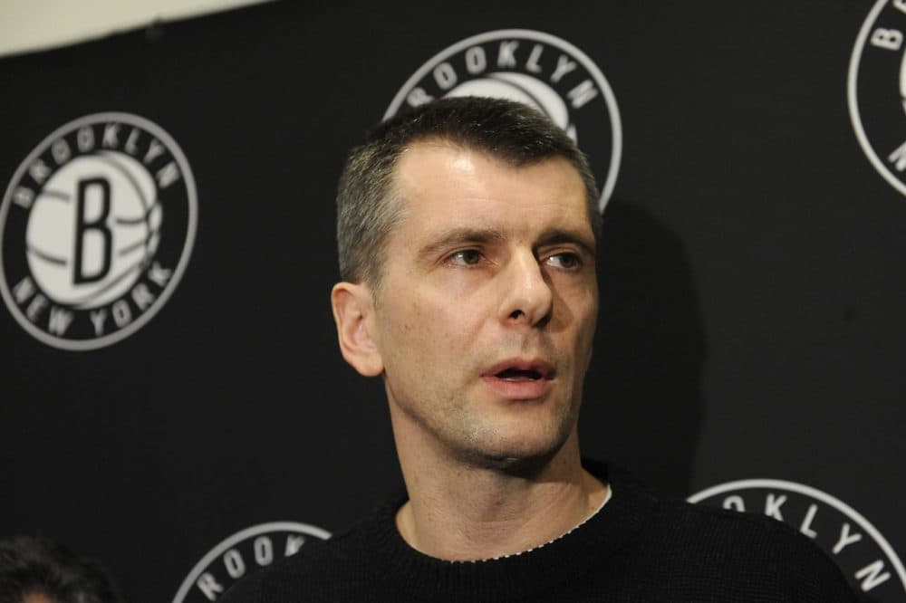 Russian billionaire and Brooklyn Nets owner Mikhail Prokhorov has announced plans to transfer ownership of the basketball team to one of his Russian companies, but it's unclear whether or not the NBA will allow it. (Kathy Kmonicek/AP Photo)