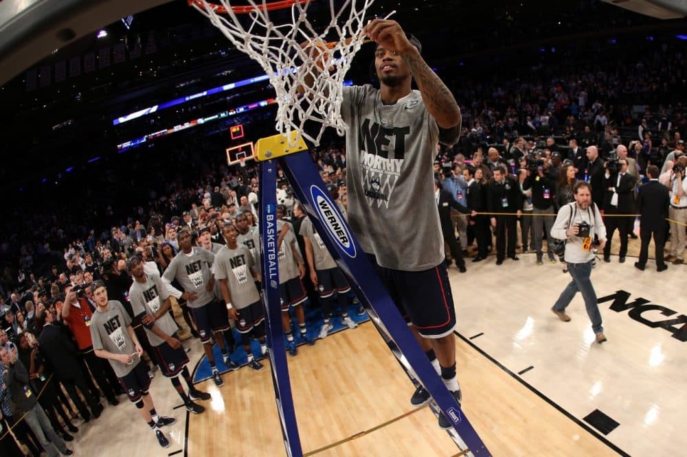 When UConn beat Michigan to advance to the Final Four, it was worthy of a net cutting ceremony. But with seven postseason tournaments are too many nets facing the scissors? (Bruce Bennett/Getty Images)