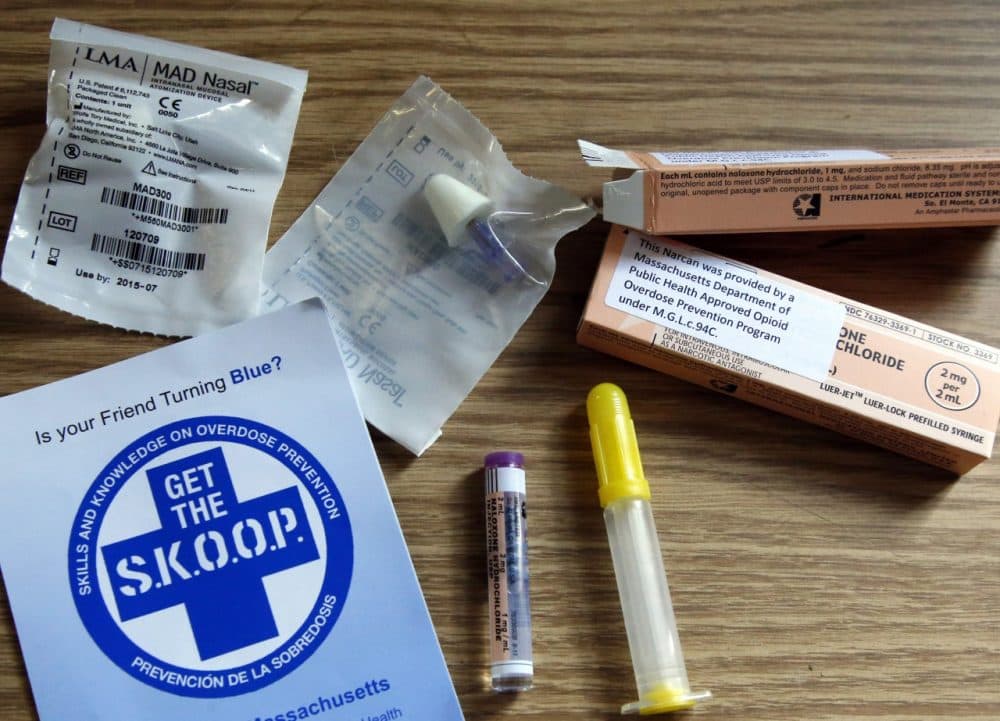 An educational pamphlet and samples of naloxone, a drug used to counter the effects of opiate overdose, are displayed at a news conference at the fire station in Taunton, Mass., Monday, Feb. 24, 2014. (AP/Elise Amendola)