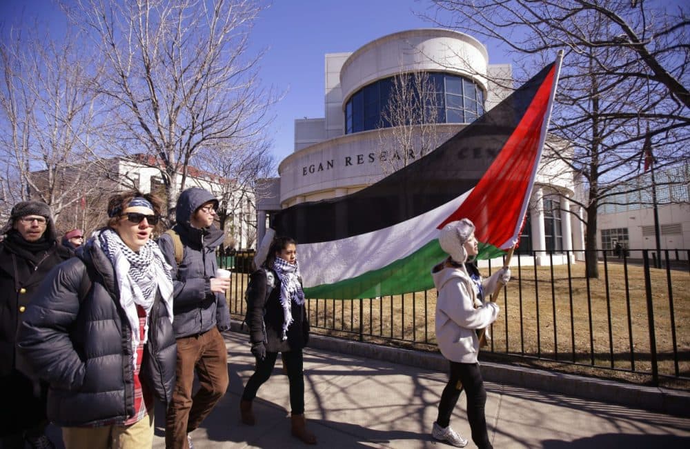 Students and supporters march across campus during a protest in support of Palestine after a Northeastern University student organization, Students for Justice in Palestine, was &quot;temporarily suspended for multiple violations of university policy over an extended period of time,&quot; according to a university statement in Boston, Tuesday, March 18, 2014. (AP)