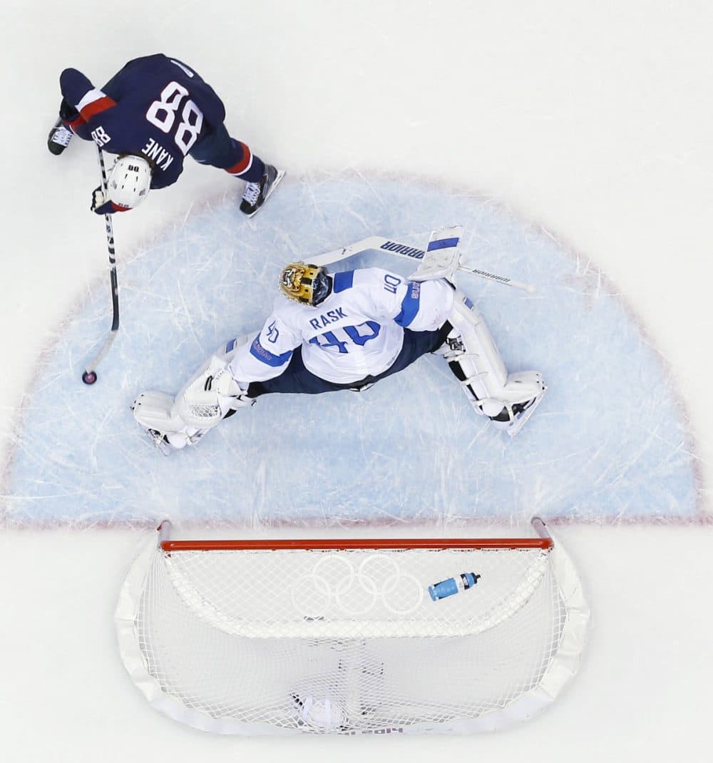 Finland goaltender Tuukka Rask blocks a shot by USA forward Patrick Kane during the first period of the men's bronze medal ice hockey game at the 2014 Winter Olympics, Saturday, Feb. 22, 2014, in Sochi, Russia. (AP)