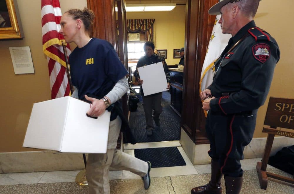 FBI investigators leave the office of Rhode Island House Speaker Gordon Fox at the State House in Providence, R.I. (Michael Dwyer/AP)