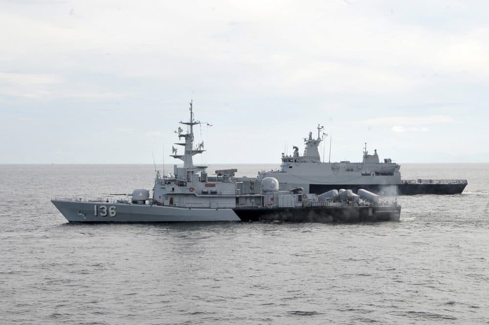 In this photo released by The Royal Malaysian Navy, Royal Malaysian Navy's missile corvette KD Laksamana Muhammad Amin, front, and Royal Malaysian Navy's offshore patrol vessel KD Selangor are seen during a search and rescue operation for the missing Malaysia Airlines plane over the Straits of Malacca, Malaysia, Thursday, March 13, 2014. (AP)