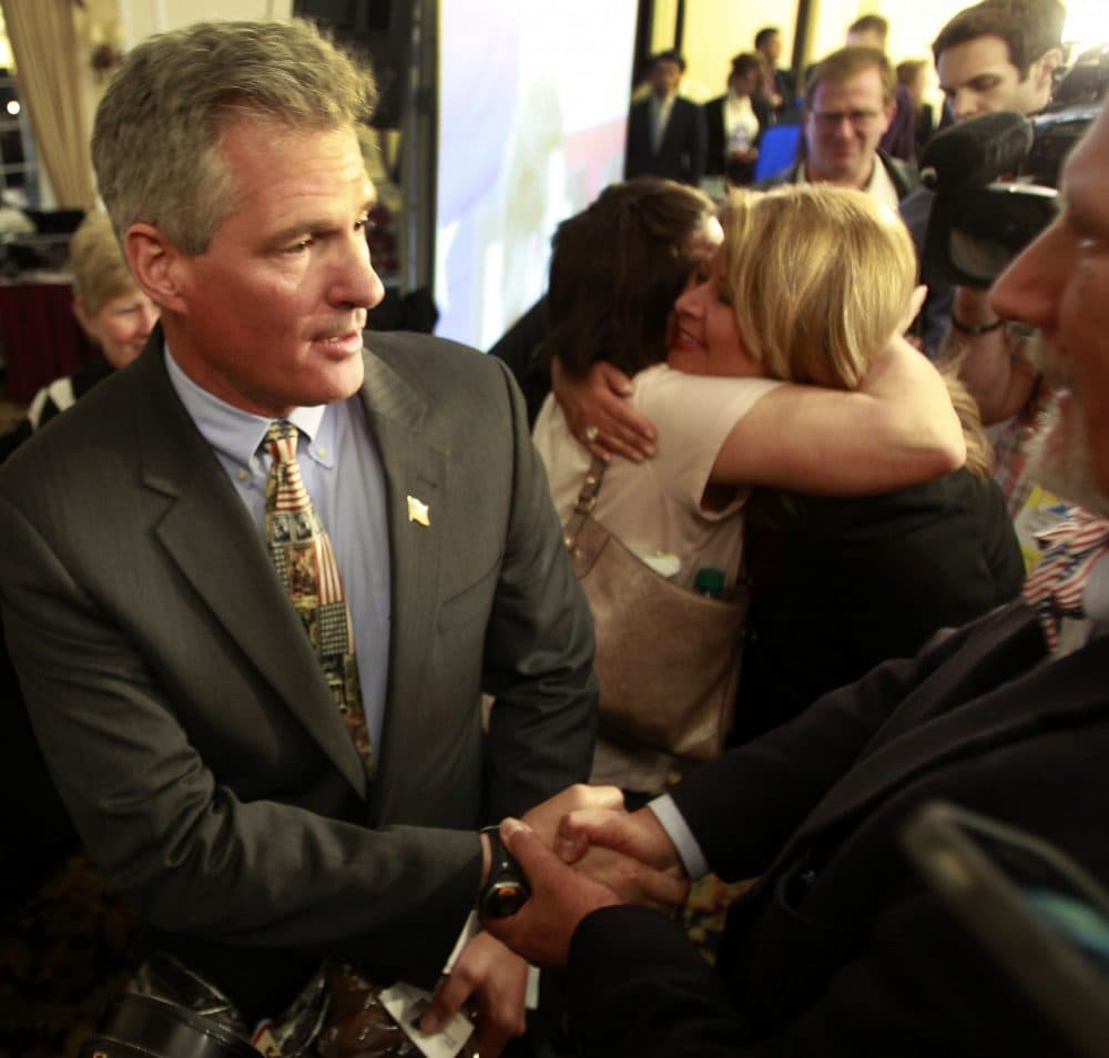 Former Massachusetts Senator Scott Brown greets supporters after announcing plans to form an exploratory committee to enter New Hampshire's U.S. Senate race. (AP/Jim Cole)