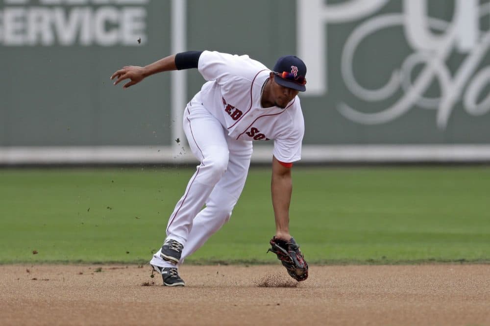 Boston Red Sox shortstop Xander Bogaerts fields a groundout during an exhibition baseball game in Fort Myers, Fla., Saturday, March 29. (AP/Gerald Herbert)