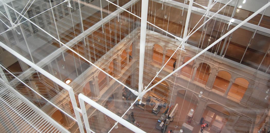 Looking down from the glass-roofed atrium to the courtyard floor five stories below. (Greg Cook)