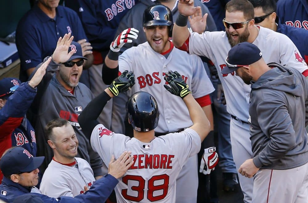Teammates greet Boston Red Sox' Grady Sizemore (38) in the dugout after he hit a solo home run in the fourth inning.  (AP/Patrick Semansky)