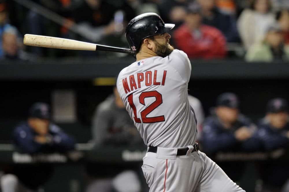 Mike Napoli (12) follows through on his single that drove in two runs during the seventh inning of Wednesday’s game in Baltimore. The Red Sox won 6-2. (AP Photo/Nick Wass)