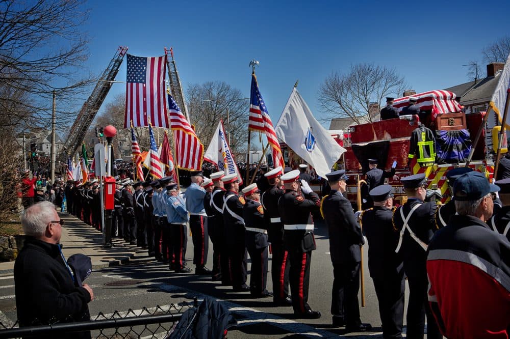 Engine 33 passes through down Centre Street on its way to Forest Hills Cemetery. (Jesse Costa/WBUR)