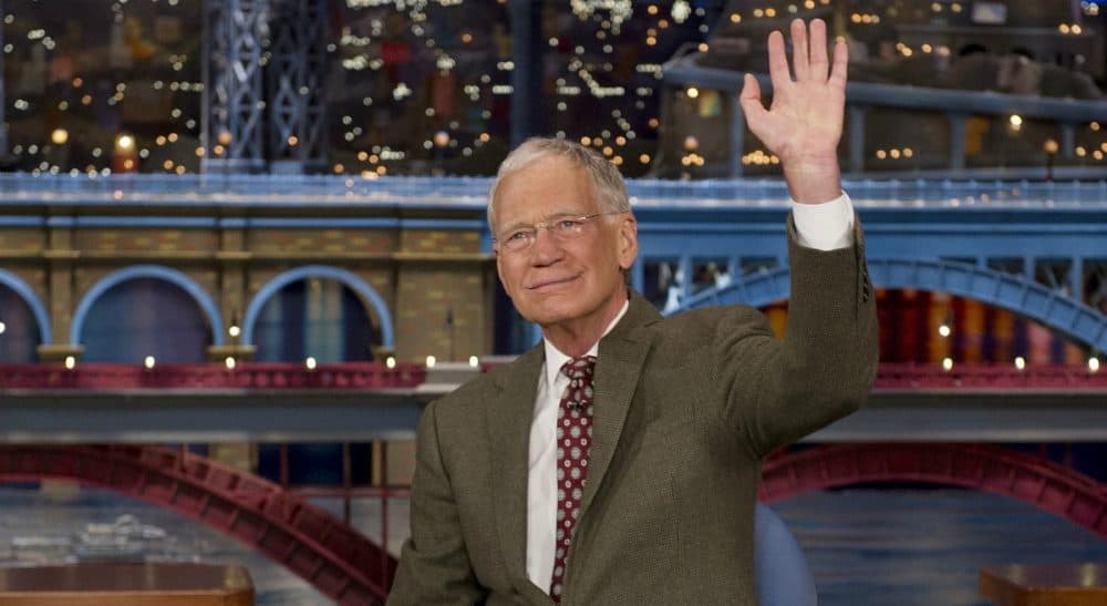 In this photo, David Letterman, host of the “Late Show with David Letterman,” waves to the audience in New York on Thursday, April 3, 2014, after announcing that he will retire sometime in 2015. Letterman, 66, has the longest tenure of any late-night talk show host in U.S. television history, already marking 32 years since he created &quot;Late Night&quot; at NBC in 1982. (Jeffrey R. Staab/AP) 