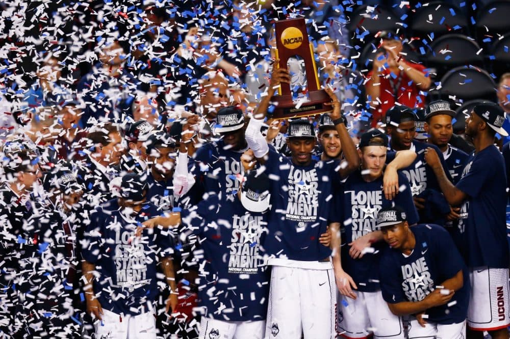 The UConn men's basketball team celebrates their national championship victory. (Tom Pennington/Getty Images)