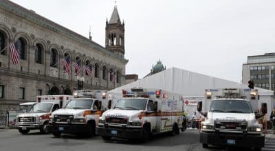 Dr. Joshua Liao on the lessons he learned from the 2013 Boston Marathon medical response. In this photo, ambulances sit outside the medical tent at the Boston Marathon finish line, Monday, April 15, 2013. (Elise Amendola/AP)