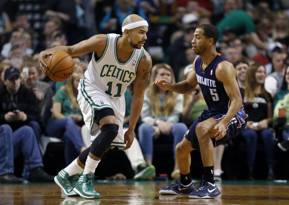 Boston Celtics' Jerryd Bayless (11) looks to move against Charlotte Bobcats' Jannero Pargo (5) in the first quarter of an NBA basketball game in Boston. (Michael Dwyer/AP)