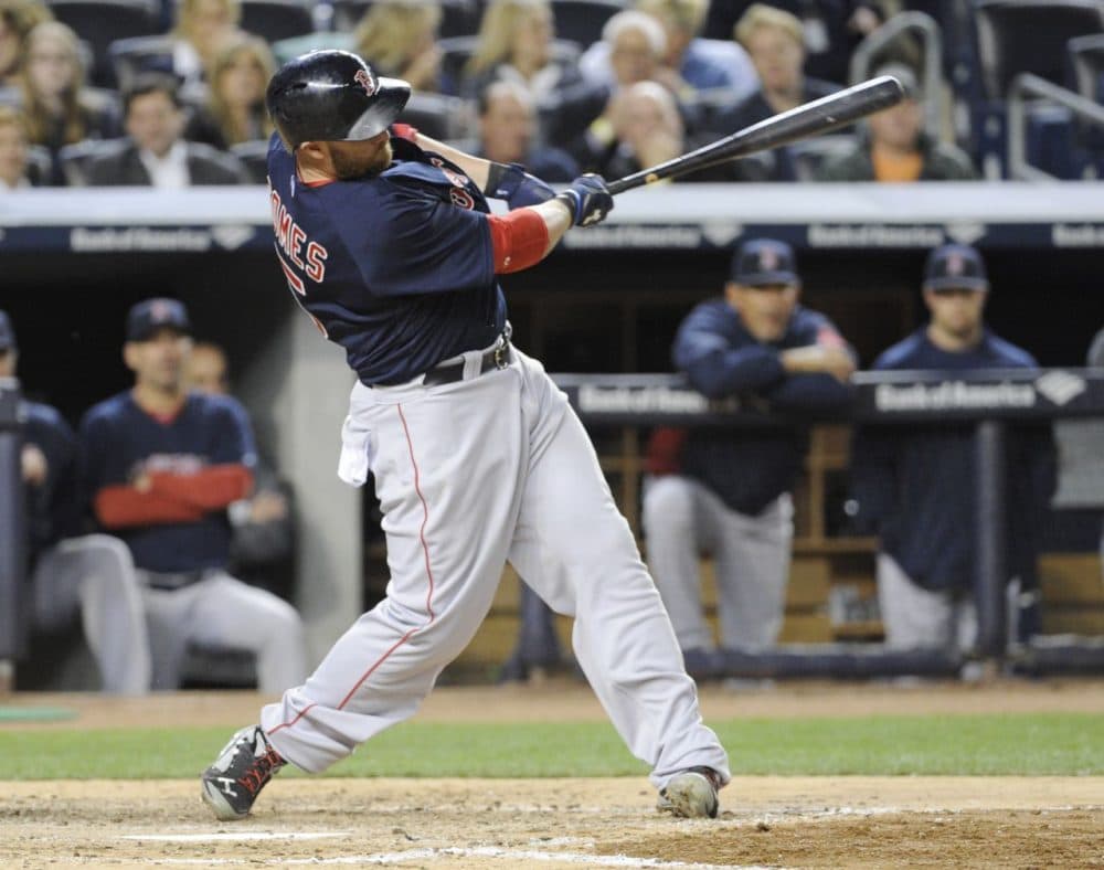 Boston Red Sox batter Jonny Gomes hits a home run during the sixth inning of a baseball game against the New York Yankees. (Bill Kostroun/AP)