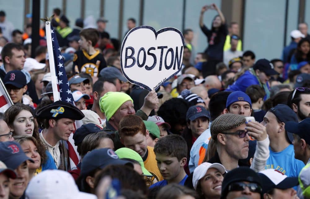 A crowd gathered at the finish line of the Boston Marathon Saturday morning for a Sports Illustrated cover shoot before the one-year anniversary of the bombings. (Michael Dwyer/AP)