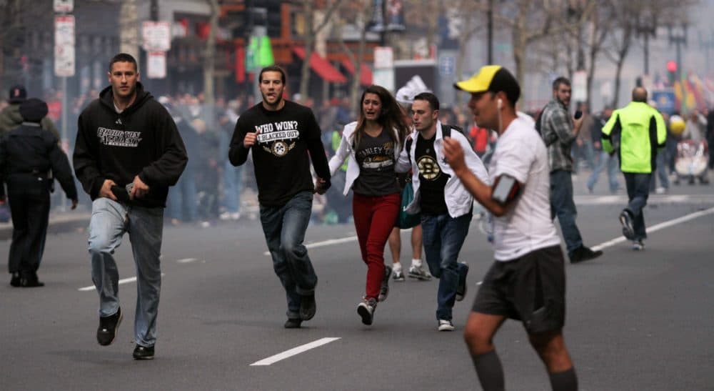 William Powers: What the Marathon attacks taught me about the relationship between modern technology and being human. In this photo, people react to the explosions at the 2013 Boston Marathon in Boston, Monday, April 15, 2013. (The Daily Free Press, Kenshin Okubo/AP)