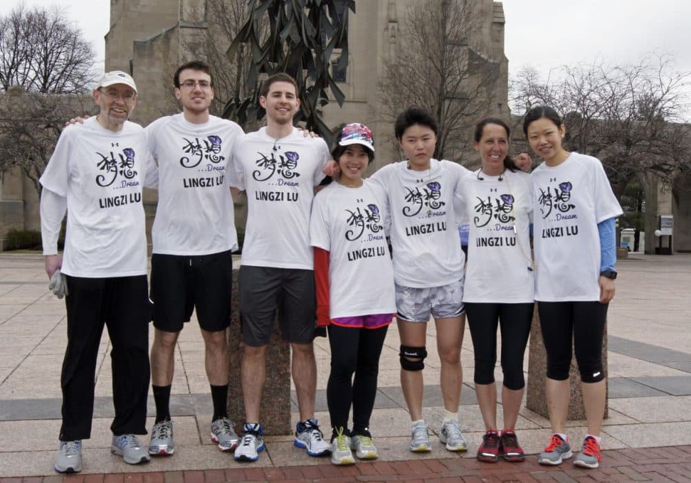 BU's Lu Lingzi Boston Marathon team. From left to right: Andrew Duffy, Dan Mercurio, Ryan Shea, Baiyun Yao, Yujue Wang, Jennifer Carter-Battaglino, Shuheng Lin. (Lynn Jolicoeur/WBUR)