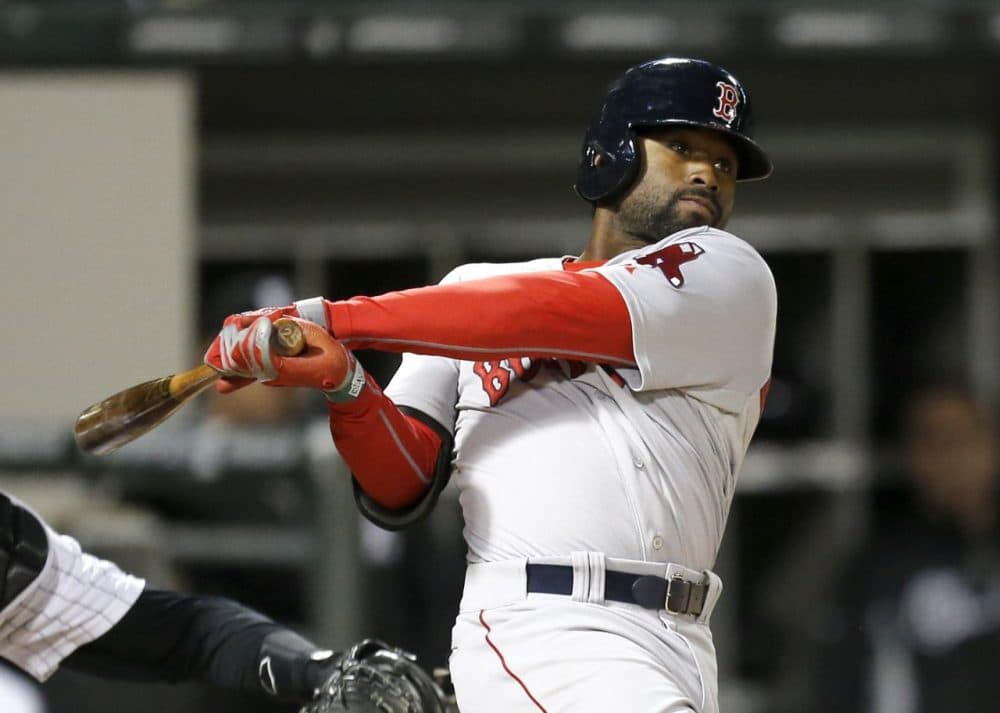 Boston Red Sox's Jackie Bradley Jr. hits a two-run double off Chicago White Sox second baseman Leury Garcia, who was pitching in relief, during the 14th inning. (AP/Charles Rex Arbogast)
