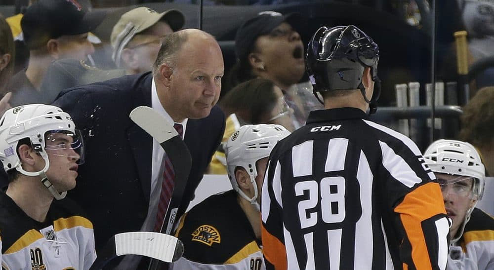 Boston Bruins head coach Claude Julien talks to referee Chris Lee (28) during the third period of an NHL hockey game against the Tampa Bay Lightning Saturday, Oct. 19, 2013, inTampa, Fla. (Chris O'Meara/AP)