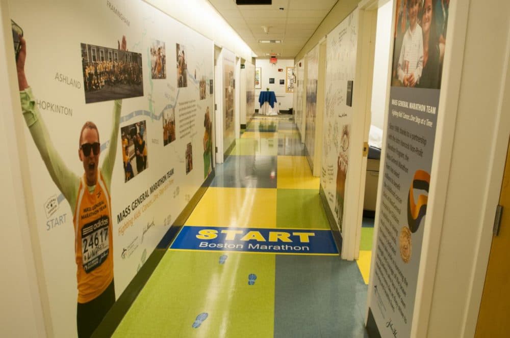 A mural in MGH’s pediatric cancer clinic tells the story of the hospital’s marathon team, which was founded by Dr. Howard Weinstein, chief of MGH’s pediatric hematology-oncology program, in 1998. (Courtesy MGH)
