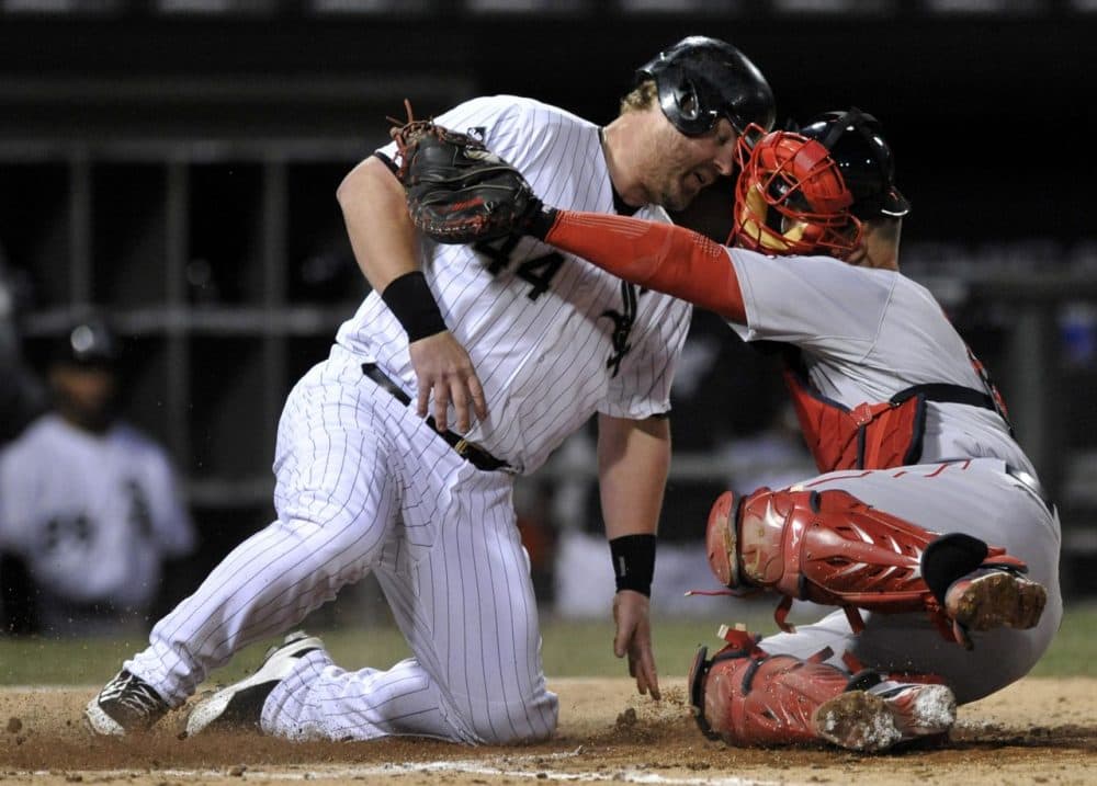 Boston Red Sox catcher David Ross, right, tags out Chicago White Sox's Adam Dunn (44) at home plate during the seventh inning. (AP/Paul Beaty)