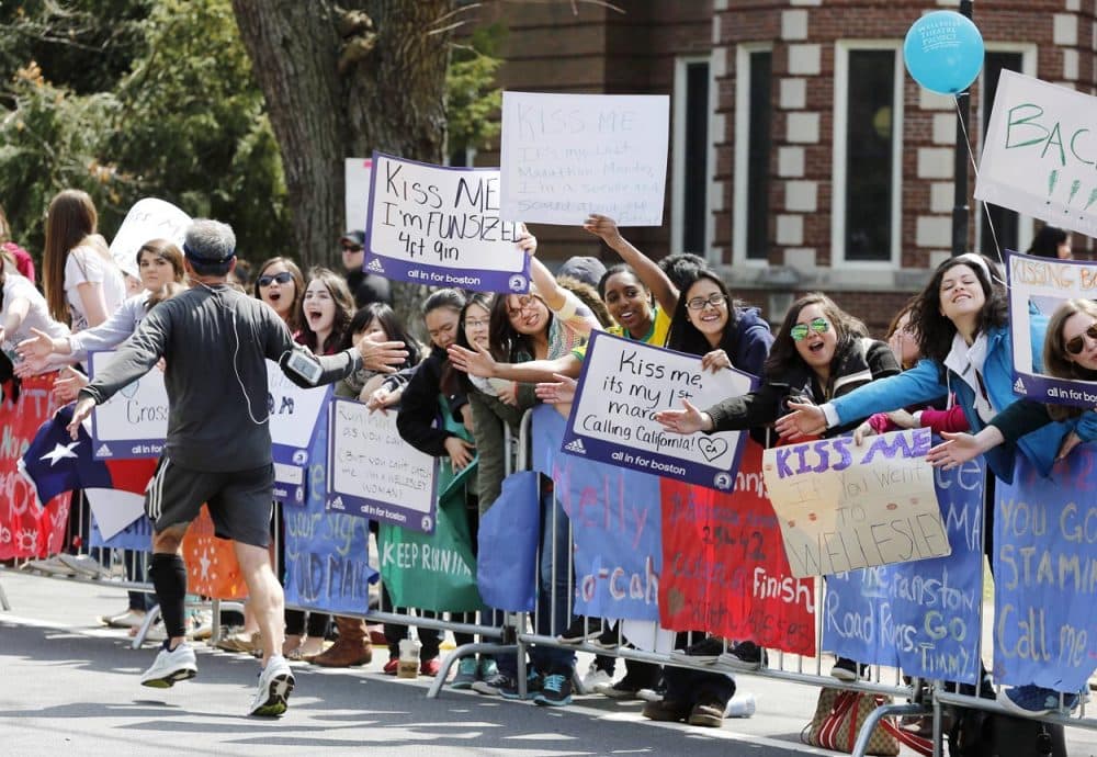 Wellesley College students cheer the runners during the 2013 Boston Marathon. (Michael Dwyer/AP)