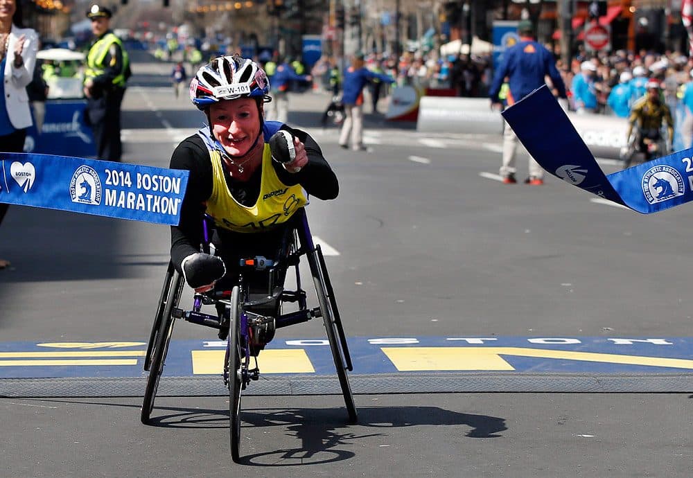 Tatyana McFadden, of the U.S., breaks the tape to win the women's wheelchair division of the 118th Boston Marathon. (Elise Amendola/AP)