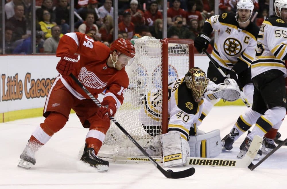Boston Bruins goalie Tuukka Rask (40) of Finland, stops a goal attempt by Detroit Red Wings center Gustav Nyquist (14). (AP/Carlos Osorio)