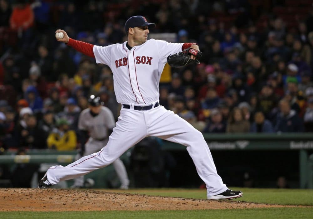 Boston Red Sox starting pitcher John Lackey delivers to the New York Yankees in April. (Elise Amendola/AP)